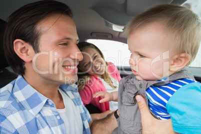 Parents and baby on a drive