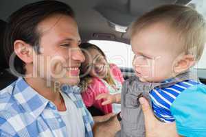 Parents and baby on a drive