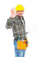 Smiling handyman gesturing okay