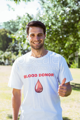 Blood donor showing thumbs up
