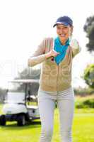 Female golfer smiling at camera