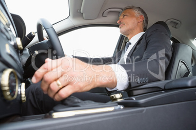 Handsome businessman in the drivers seat