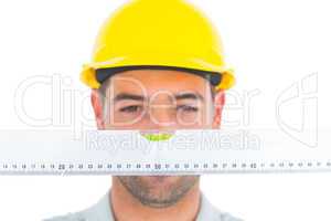 Handyman looking at spirit level