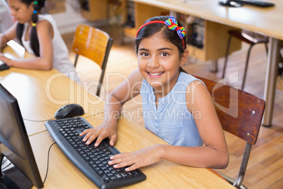 Cute pupil in computer class