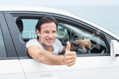 Man smiling and showing thumbs up