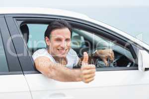 Man smiling and showing thumbs up