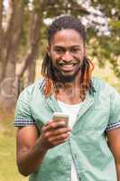 Happy young man using smartphone