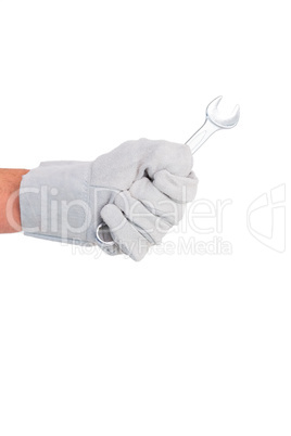 Mechanic holding spanners on white background