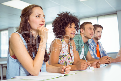 Fashion students taking notes in class