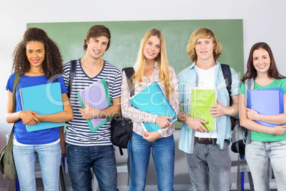 Happy college students holding folders