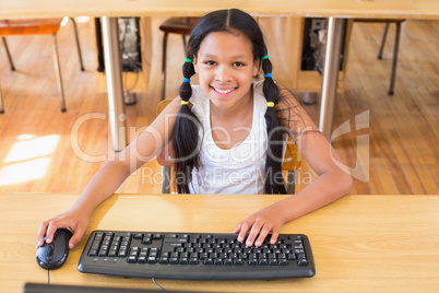 Cute pupil in computer class Cute pupil in computer class