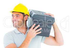 Handyman carrying toolbox on shoulder