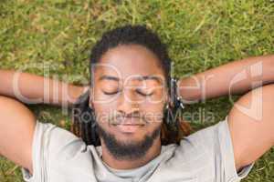 Handsome hipster relaxing in the park