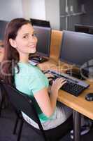 Student using computer in classroom