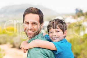 Father and son hiking through mountains