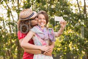 Friends taking a selfie in the park