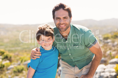 Father and son hiking through mountains