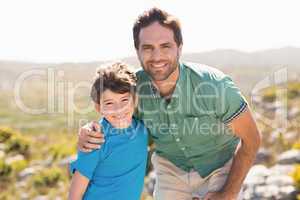 Father and son hiking through mountains