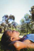 Fit woman lying in the park