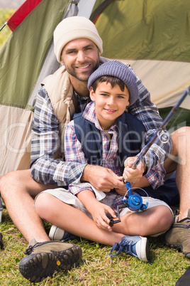 Father and son in their tent