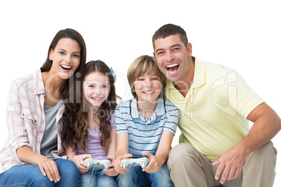 Happy family playing video game together