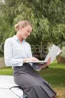 Young businesswoman using laptop