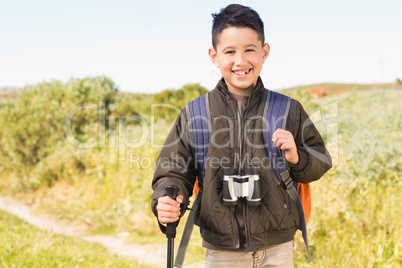 Little boy hiking in the mountains