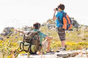 Father and son hiking through mountains