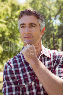 Casual man thinking in the park
