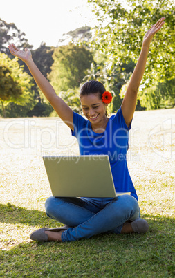 Woman using tablet in park
