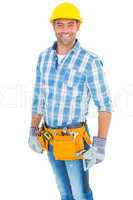 Portrait of smiling handyman wearing tool belt