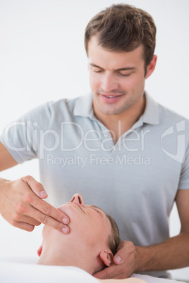 Woman receiving head massage