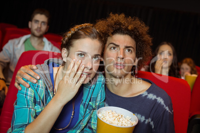 Young friends watching a film