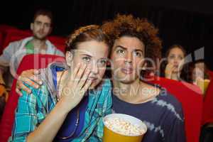 Young friends watching a film