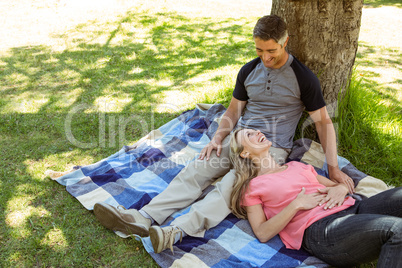 Happy couple relaxing in the park