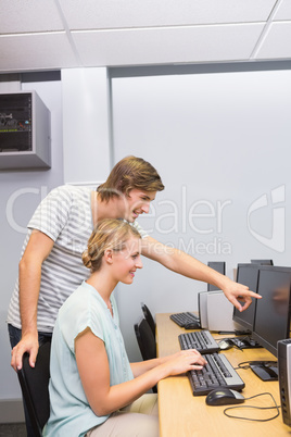 Students working on computer in classroom