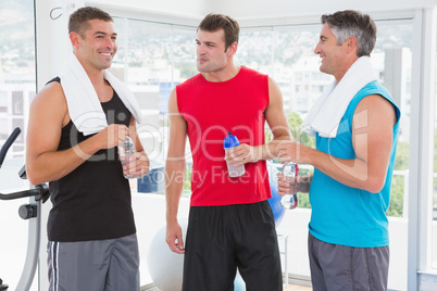 Group of smiling men talking each other