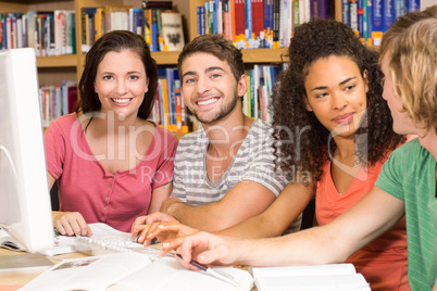 College students using computer in library College students using computer in library