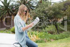 Young woman reading a map