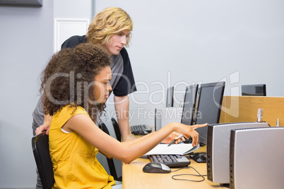 Students working on computer in classroom