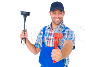 Handyman holding plunger and wrench on white background