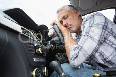 Drunk man slumped on steering wheel