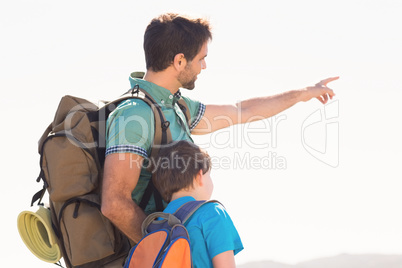 Father and son hiking through mountains