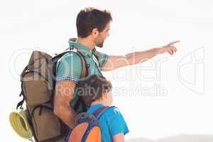 Father and son hiking through mountains