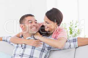 Couple looking at each other in house