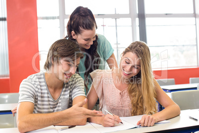 Students writing notes in classroom