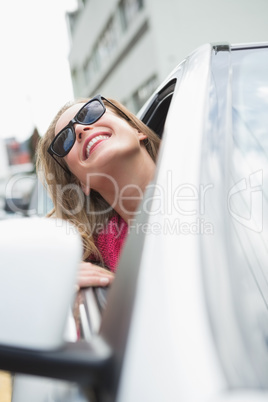 Happy woman in the drivers seat