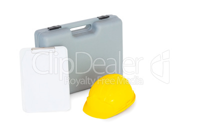 Toolbox, hardhat and clipboard on white background