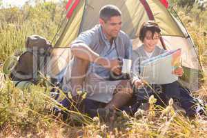 Father and son in their tent