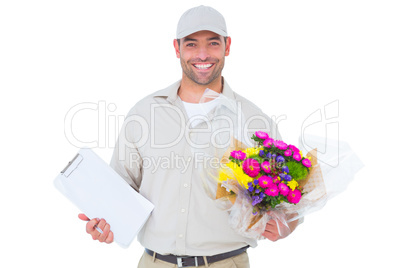 Happy flower delivery man holding clipboard